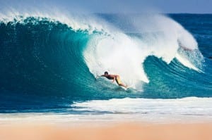 Carlos Munos surfing in Hawaii