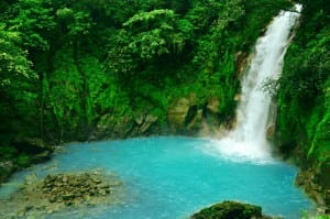 Rio Celeste's 100-foot waterfall spills into a turquoise pool