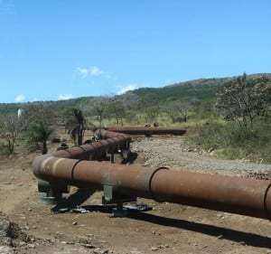 Piping for geothermal energy snake through dry forest around Rincon de la Vieja Volcano