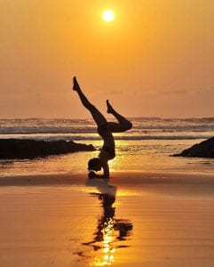 Yoga and sunsets at Santa Teresa beach, photo credit @nancygoodfellowyoga.