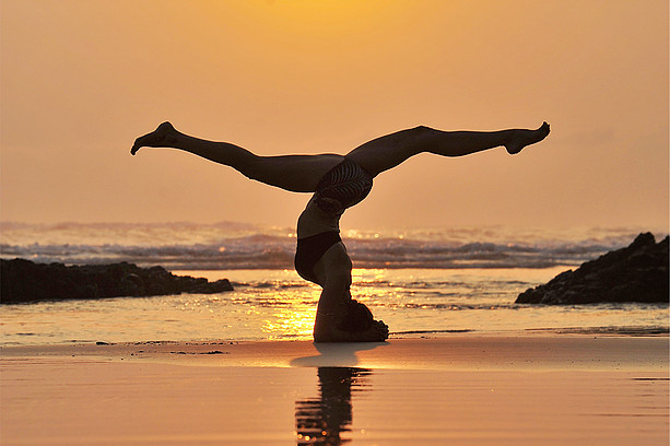 Premium Photo | Yoga pose with beach and sunset view